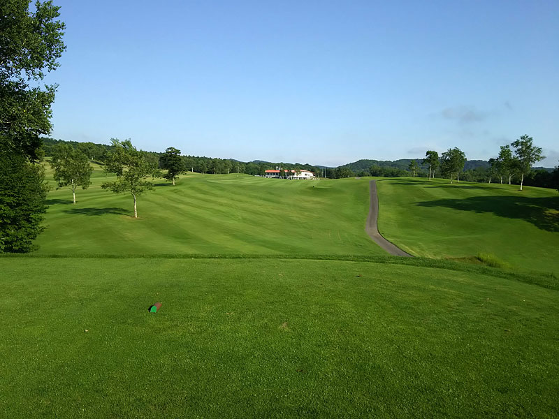 A wide fairway rising towards the clubhouse at Chitose Country Club