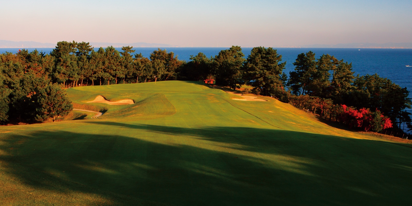 Fairway along the sea at sunset, Osaka Golf Club