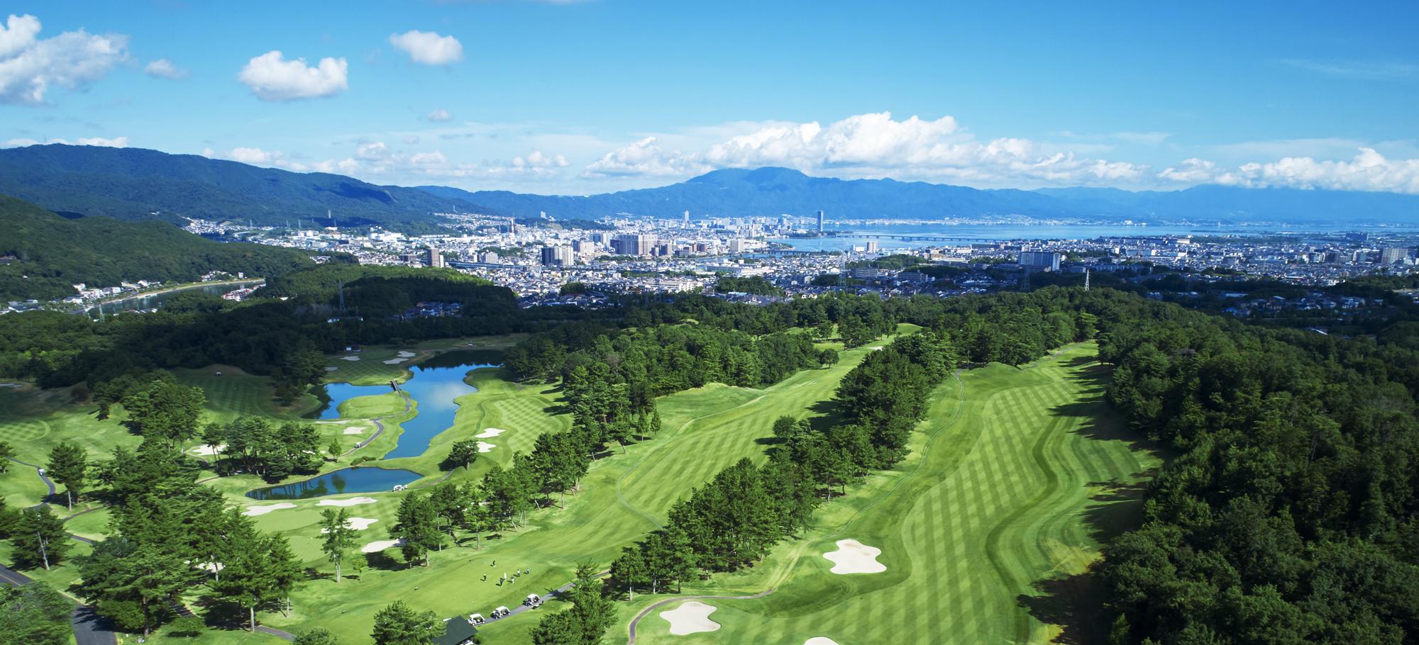 Seta Golf Course seen from above, with Otsu and Lake Biwa in the distance